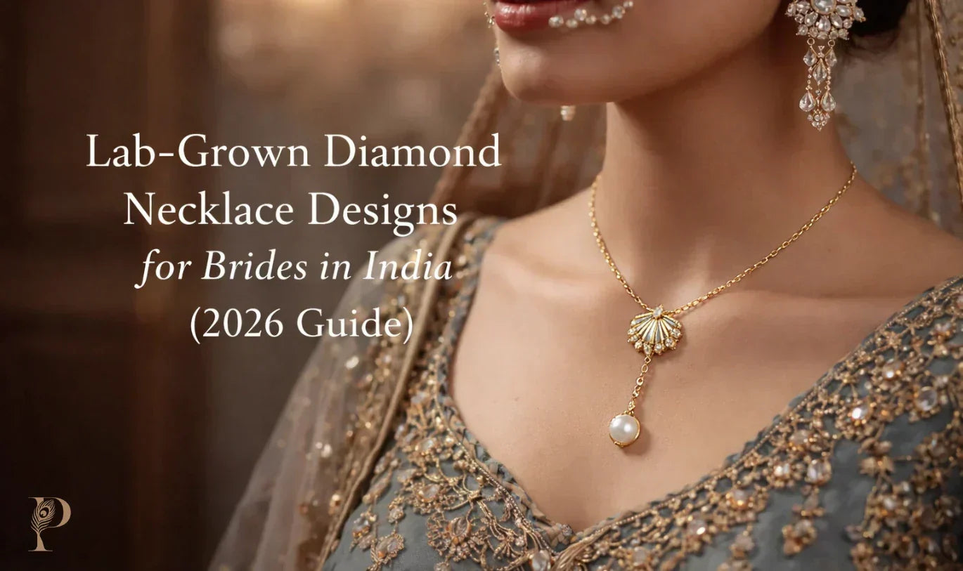 A bride in ornate attire wears a gold necklace with a pearl pendant. 